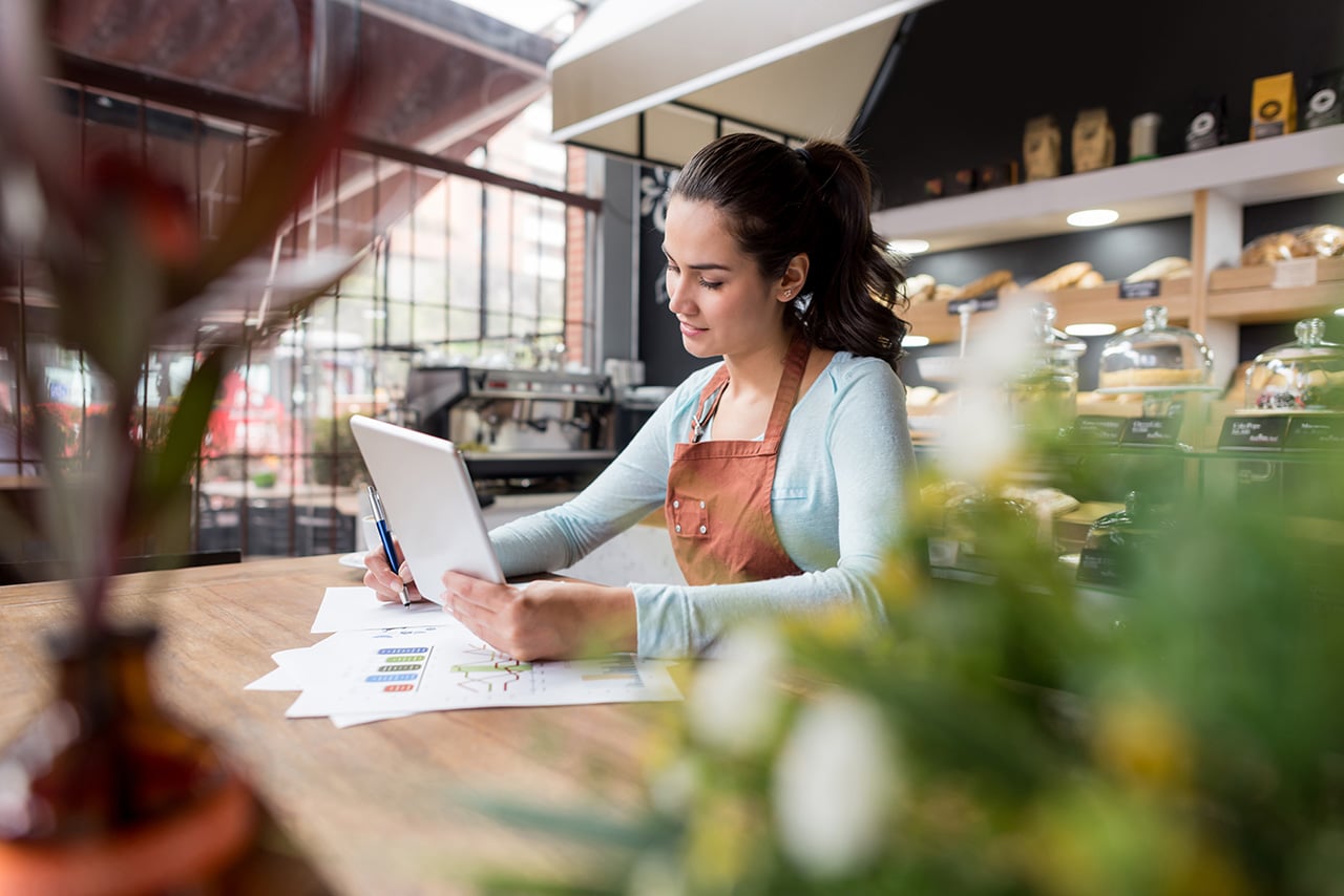 Woman doing the books at a restaurant Woman doing the books at a restaurant